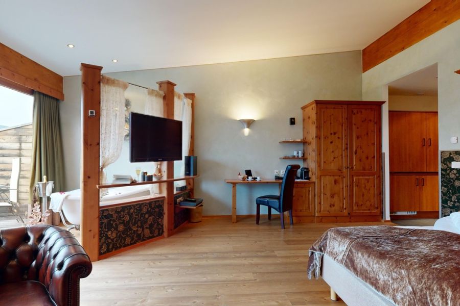 View into the room with freestanding bathtub in the junior suite apartment